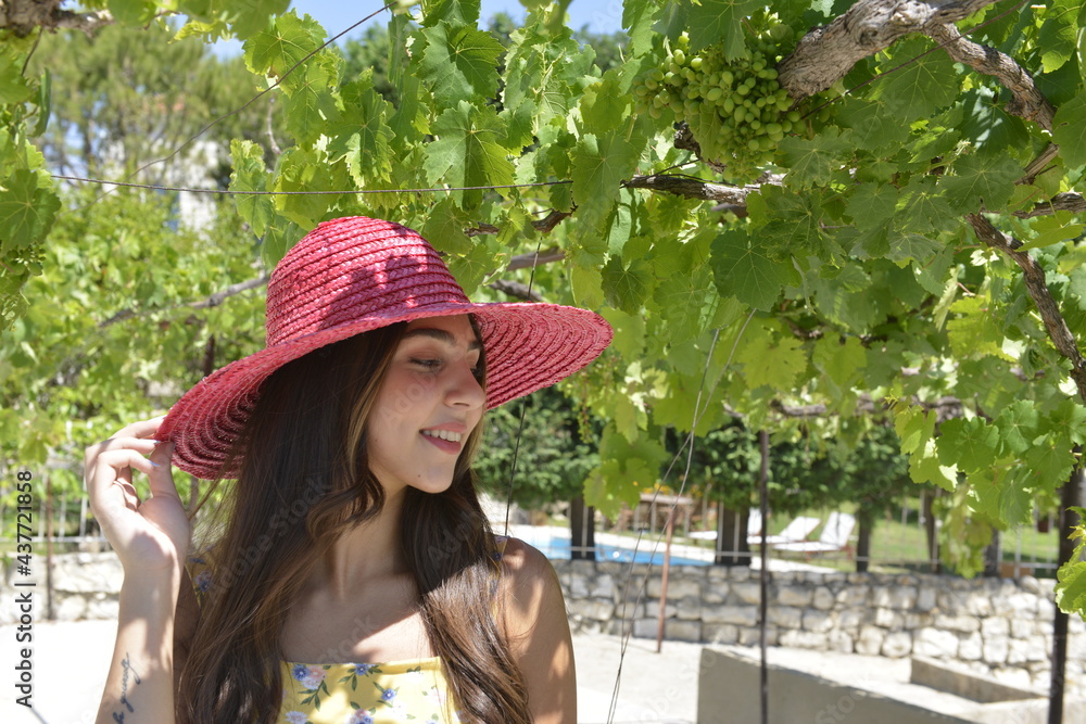 Young woman portrait. Happy girl under the vines. Summer fashion theme. Lebanese girl