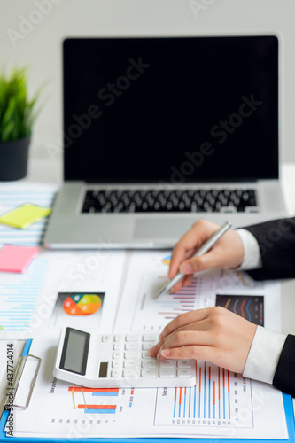 Wallpaper Mural Businesswoman hands hold documents with financial statistic stock photo,discussion and analysis data the charts and graphs.Finance, Market research reports and income statistics and Accounting concept Torontodigital.ca