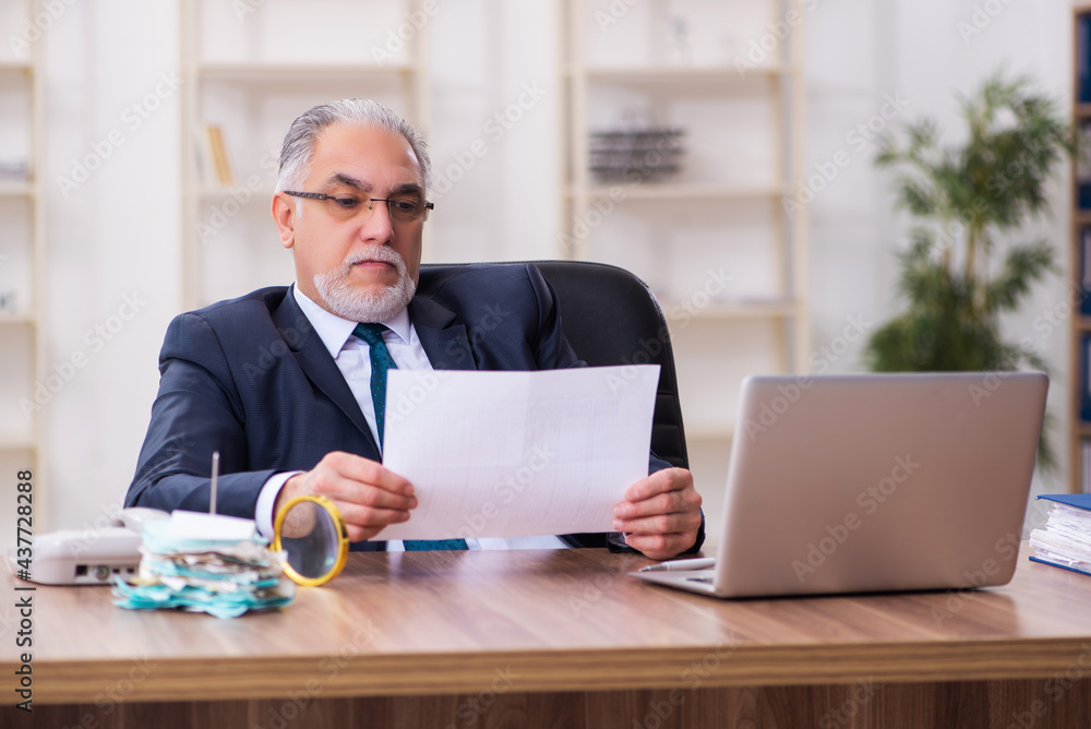 Old businessman employee in budget planning concept Old businessman employee in budget planning concept