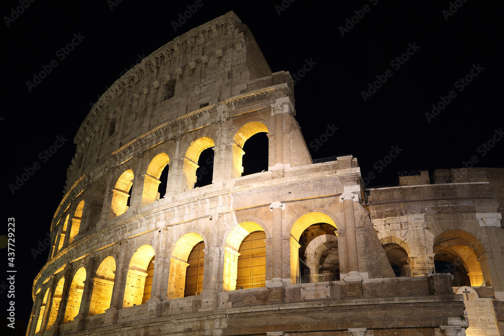 Arches of the Roman Colosseum at night. Italy

