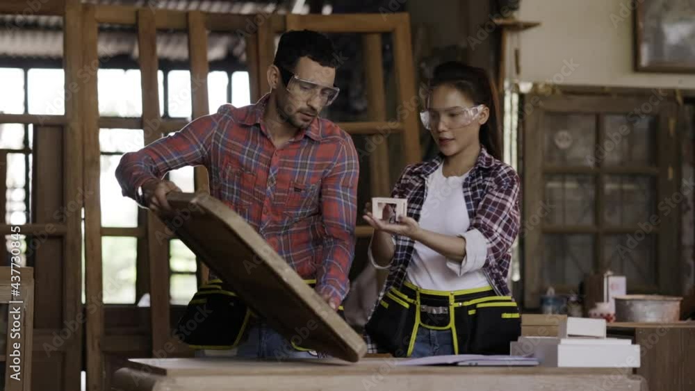 Carpentry team meeting to design furniture in factory. evaluate the work woodworking production. brainstorming design ideas. Architect designing built-in wood decoration Carpentry team meeting to design furniture in factory. evaluate the work woodworking production. brainstorming design ideas. Architect designing built-in wood decoration