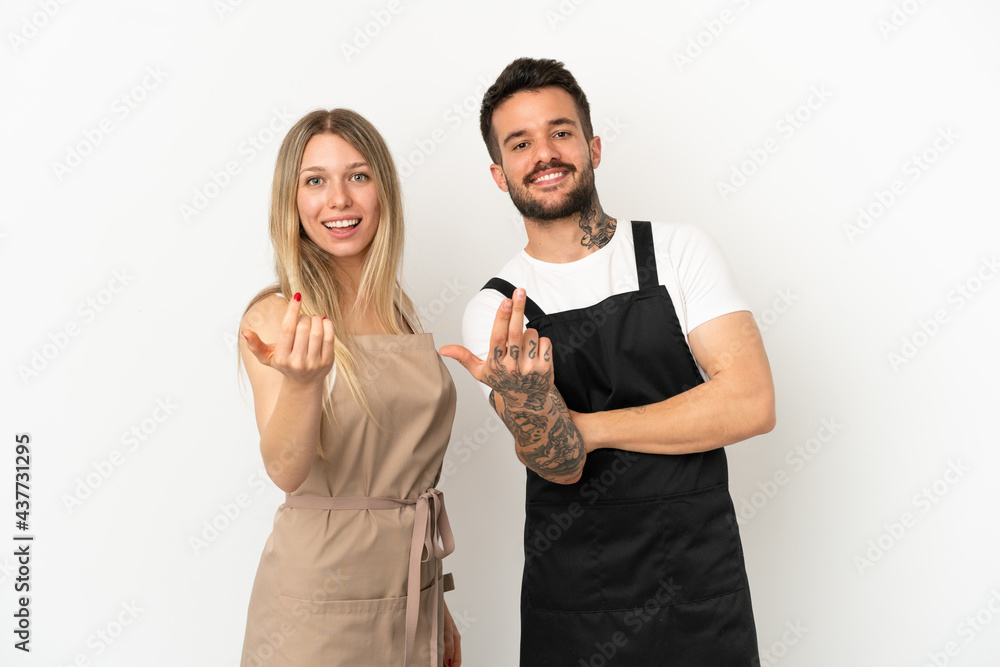Restaurant waiter over isolated white background inviting to come with hand. Happy that you came Restaurant waiter over isolated white background inviting to come with hand. Happy that you came