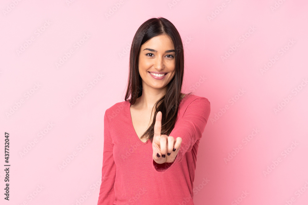 Young caucasian woman over isolated background showing and lifting a finger Young caucasian woman over isolated background showing and lifting a finger