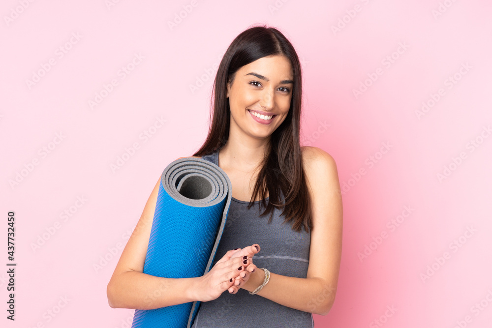 Young caucasian woman with mat isolated on pink background applauding Young caucasian woman with mat isolated on pink background applauding