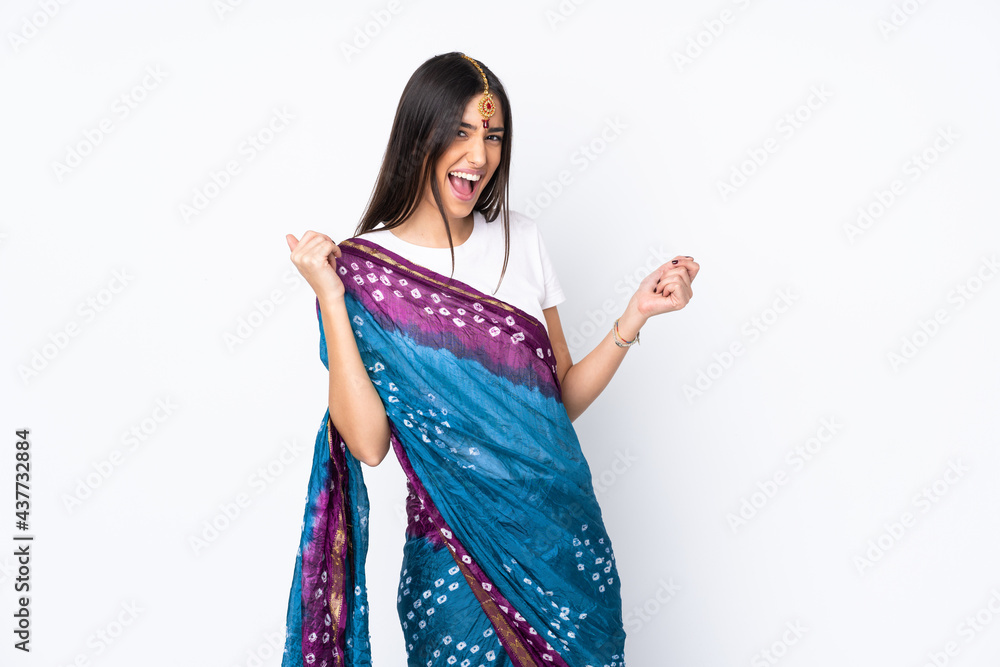 Young Indian woman isolated on white background making guitar gesture Young Indian woman isolated on white background making guitar gesture
