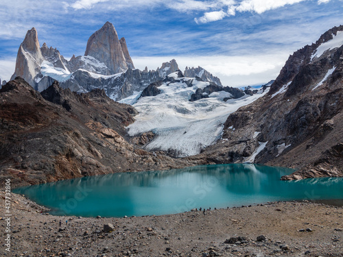 Fitz Roy Mountan, Andes, Patagagonia, Argentina. Los Glacieres National Park. Sunny Ladscape with Snowy Mountains, Turquoise Lake and Blue Cloudy Sky. Treasure of el Chalten, Patagonia.