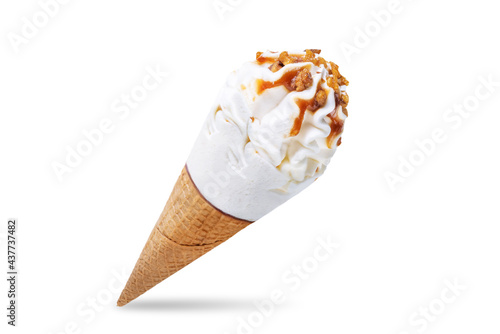 Caramel nuts vanilla ice cream in waffle cone on a white isolated background