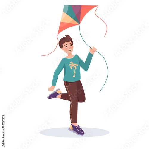 Boy with flying kite in his hands