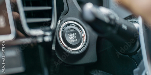 A Close Up Photograph of a Start/Stop Engine Button, in a Car, Keyless