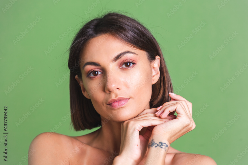 Natural beauty, portrait of topless woman with makeup and soft gentle tanned skin on green background Natural beauty, portrait of topless woman with makeup and soft gentle tanned skin on green background