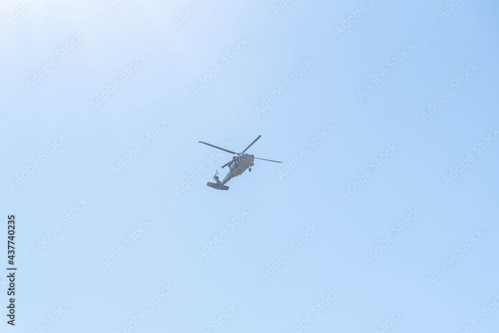 Military helicopter on blue background. Military helicopter on blue background.