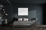 Stylish dark gray bedroom and home office interior with mock up poster
