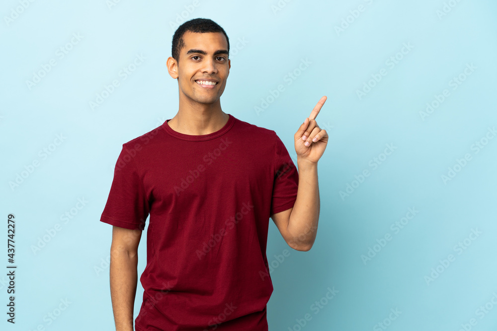 African American man over isolated background showing and lifting a finger in sign of the best African American man over isolated background showing and lifting a finger in sign of the best