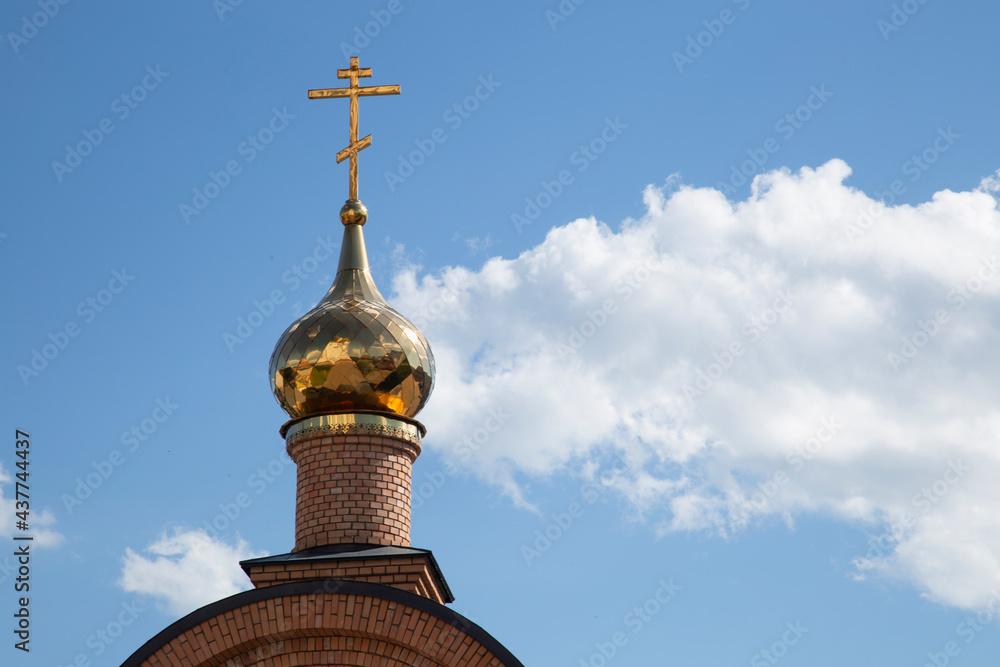 Orthodox Christian church on the background of the blue sky.