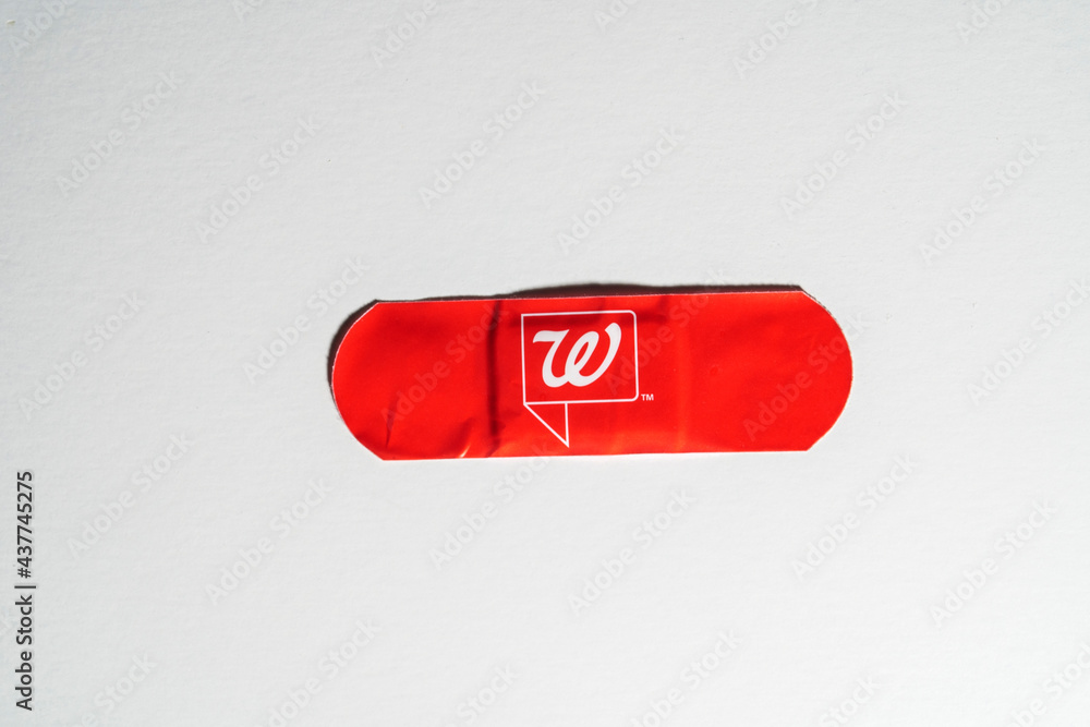Walgreens red bandage given for Covid 19 vaccine shot Stock Photo Adobe Stock