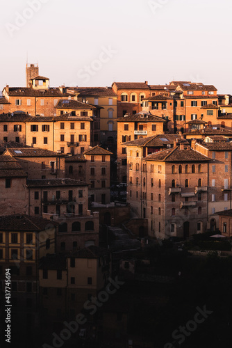 Historical buildings during the sunset in the medieval city of Siena, Tuscany, Italy