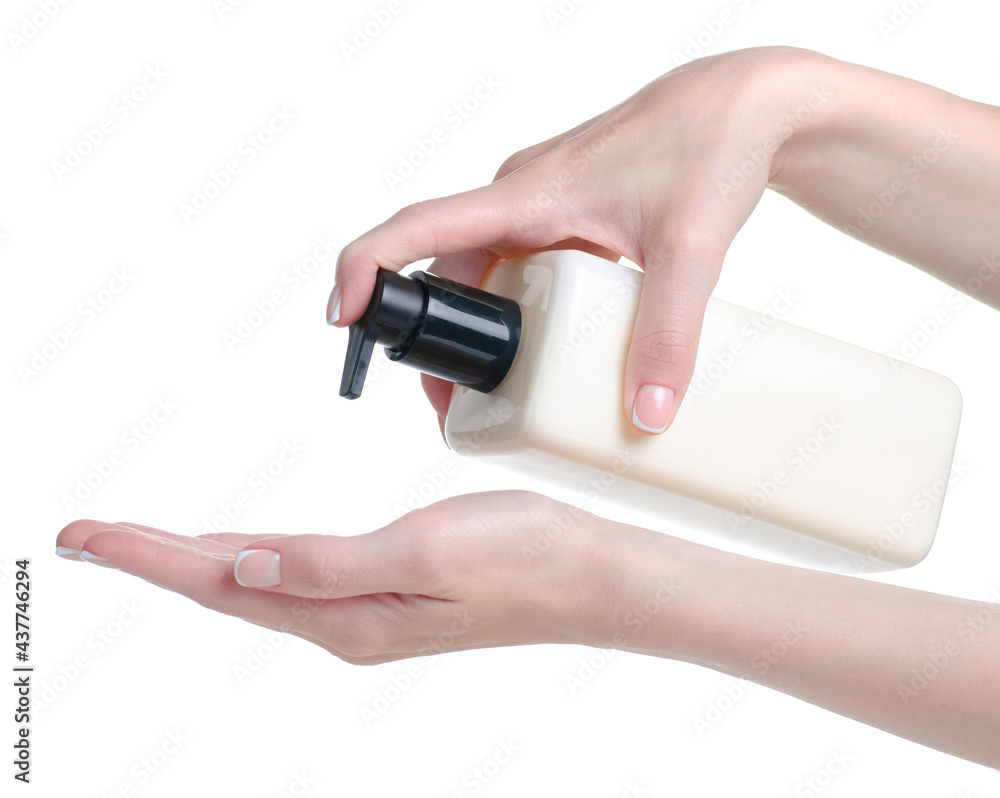 Bottle cream with dispenser beauty in hand on white background isolation Bottle cream with dispenser beauty in hand on white background isolation