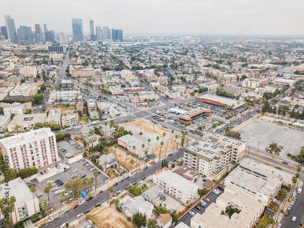 Aerial drone city view photo toward Downtown LA Los Angeles from Olympic Ave and Vermont St around Koreatown LA