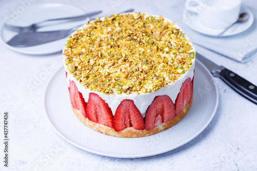 Freesier cake with fresh strawberries and pistachios. French classic dessert. Close-up. photo