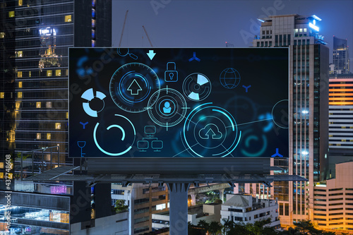 Information flow hologram on road billboard, night panorama city view of Bangkok. The largest technological center in Southeast Asia. The concept of programming science.