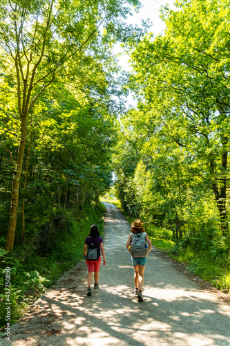 Two friends walking along the Urdaibai path, a Bizkaia biosphere reserve next to Mundaka. Basque Country