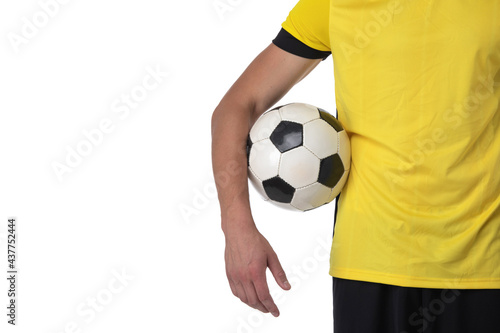 Soccer player holding a ball