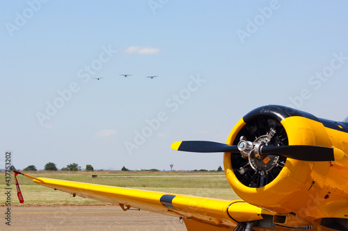 Obraz na plátně Yellow Aerobatic Aircraft With Formation On Approach, Pretoria, South Africa
