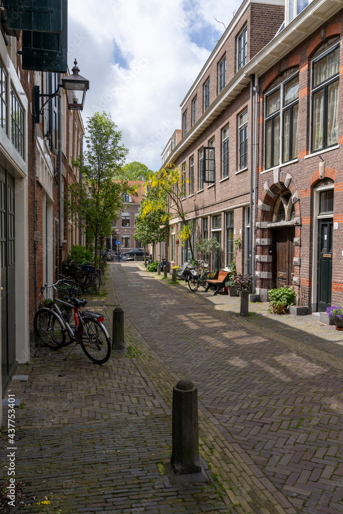 narrow cobblestone street with brick buildings in the historic city center of Haarlem