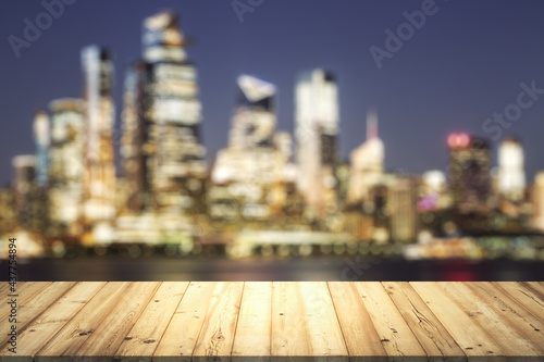 Table top made of wooden dies with beautiful blurry cityscape at twilight on background  mockup
