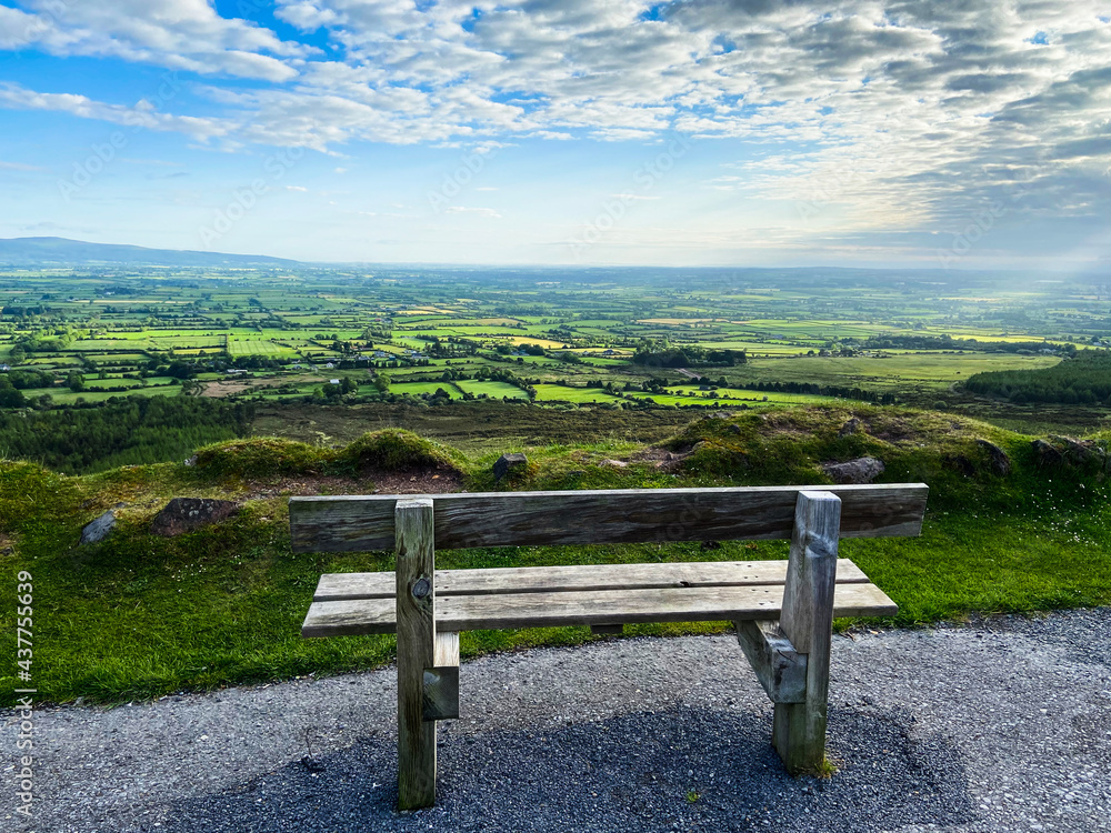 An empty bench near the edge of the road at Vee Pass, a v-shaped turn on the road leading to a gap in the Knockmealdown mountains in Clogheen county Tipperary, Ireland