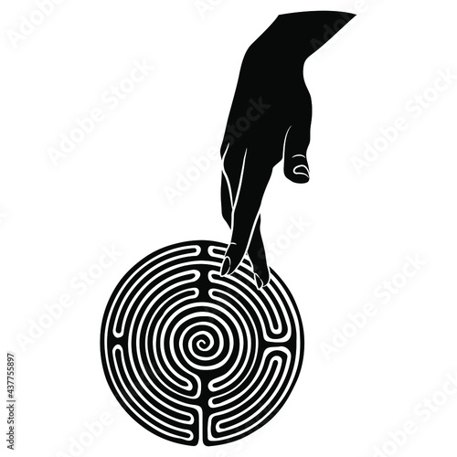 Female hand touching round spiral maze or labyrinth symbol. Ariadne. Two fingers showing walking man. Creative concept for spiritual journey. Ancient Greek mythology. Black and white silhouette.