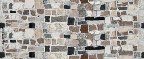 Stone pavement texture. Abstract background of cobblestone pavement close-up. Seamless texture. Perfect tiled on all sides.