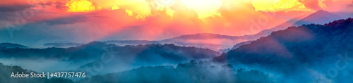Panoramic View Of Smoky Mountain Ridges With Fog And Light-rays