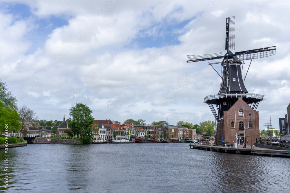 view of the Dee Adrian Windmill and Binnen Spaarne River in Haarlem