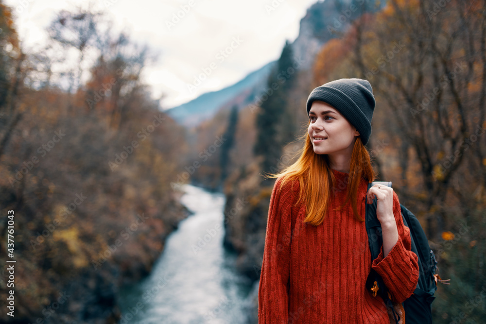 woman hiker in autumn forest near river mountains travel woman hiker in autumn forest near river mountains travel