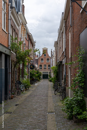 narrow cobblestone street with brick buildings in the historic city center of Haarlem