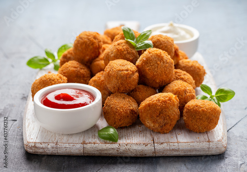 Meat free vegetarian mini picnic scotch eggs with micoprotein and herbs served with ketchup and mayonnaise