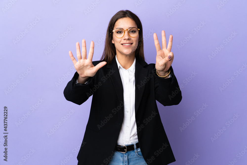 Business woman isolated on purple background counting eight with fingers Business woman isolated on purple background counting eight with fingers