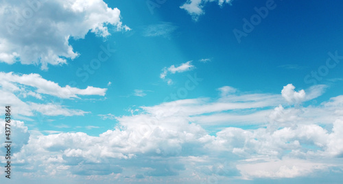 Beautiful contrasting large clouds in blue sky for background