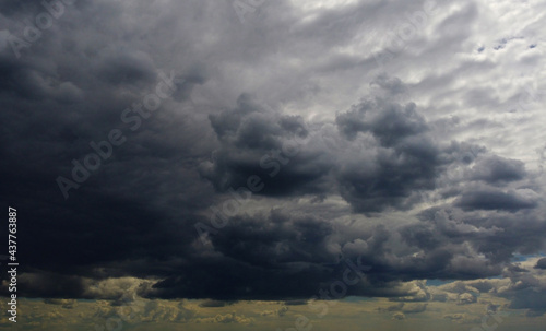 Beautiful contrasting large clouds in blue sky for background