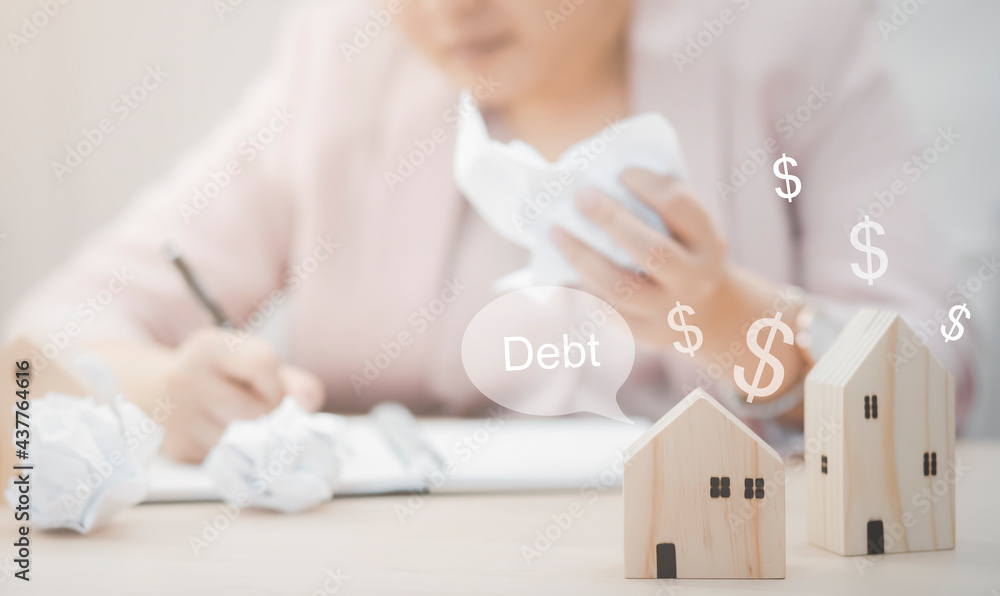 Businesswoman hand write note on paper with mini wood house model from model on wood table, Planning buy Real Estate, Planning to buy property. concept of Choose the best. Businesswoman hand write note on paper with mini wood house model from model on wood table, Planning buy Real Estate, Planning to buy property. concept of Choose the best.