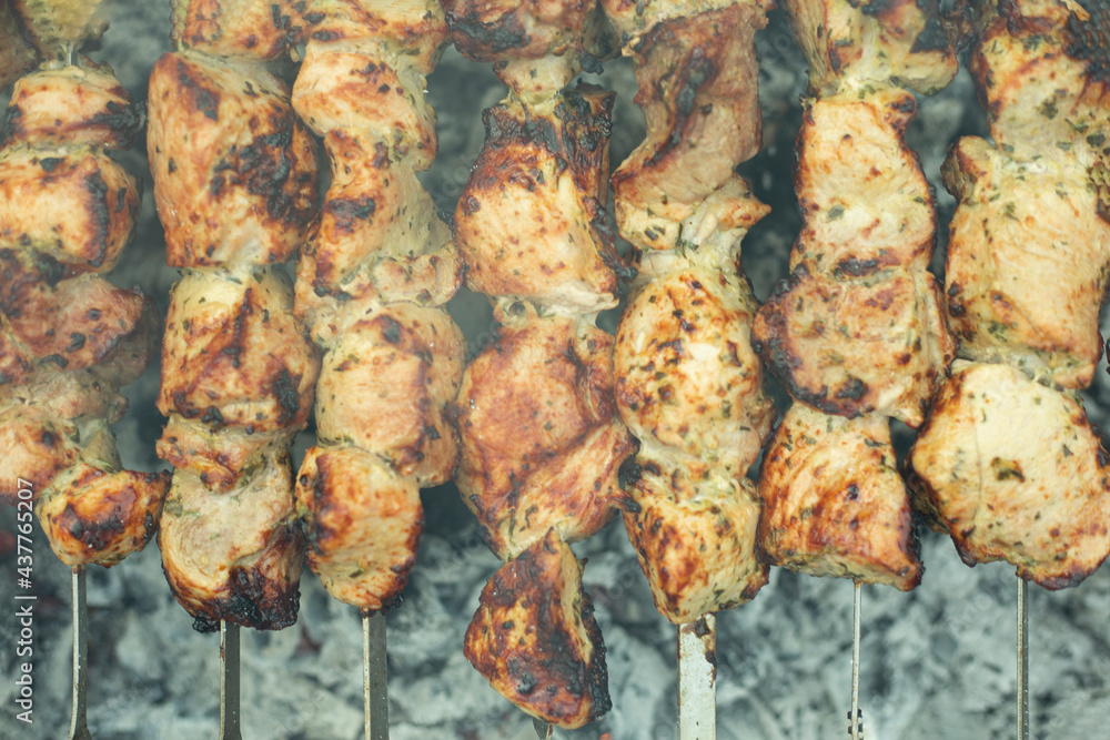Meat skewers on grill as background, closeup. Outdoor kitchen Meat skewers on grill as background, closeup. Outdoor kitchen