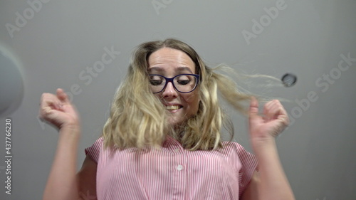 The girl gets on the scales and rejoices at the result. Weighing on scales. Close up of weight loss check. Measuring excess weight.