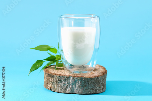 Glass of milk on a blue background. Milk products.