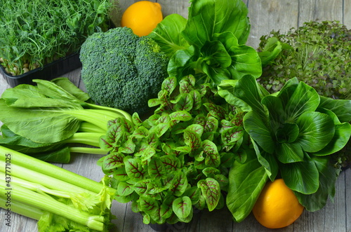 Broccoli, Cos Lettuce and Baby Spinach Leaves in arrangement.