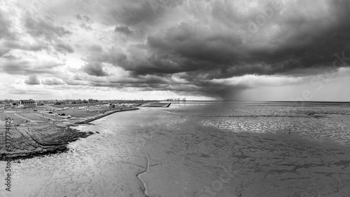 Wremen Geestland Panorama in Monochrome, Drone Views of Northern German Coast, Cutter Harbor and Stormy Horizons in Black and White, 180 degree aerial view, travel destination Wattenmeer photo