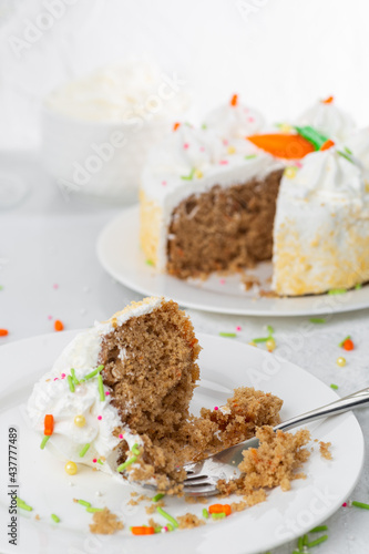 Carrot cake with icing and sprinkles at an Easter party