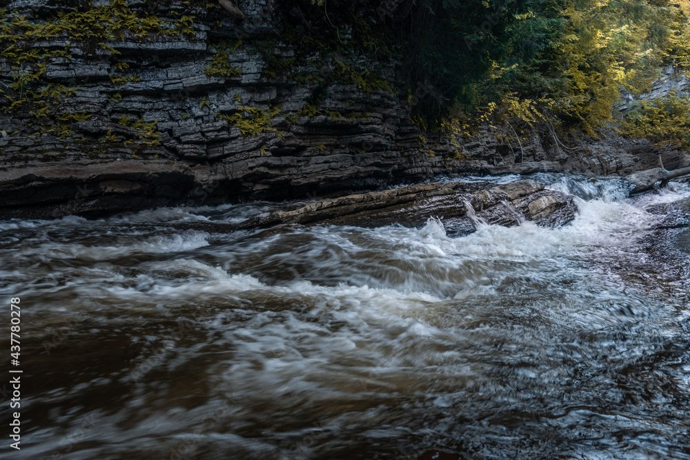 Fototapeta premium amazing photo of a nordic waterfall during a summer sunrise in Quebec, Canada
