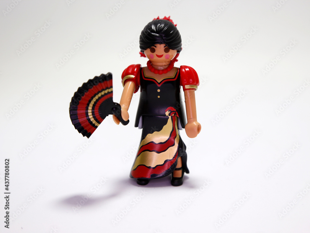 Stockfoto med beskrivningen Spanish Playmobil doll. Spanish with typical  flamenco dress. Flamenco dancer. Woman with Spanish dress and hand fan.  Collectible children's toy. Souvenir from Spain. Isolated white. | Adobe  Stock