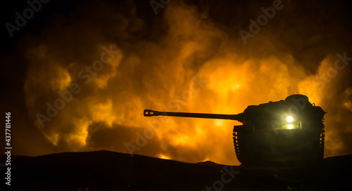 War Concept. Military silhouettes fighting scene on war fog sky background, World War Soldiers Silhouette Below Cloudy Skyline At night. Battle in ruined city. photo